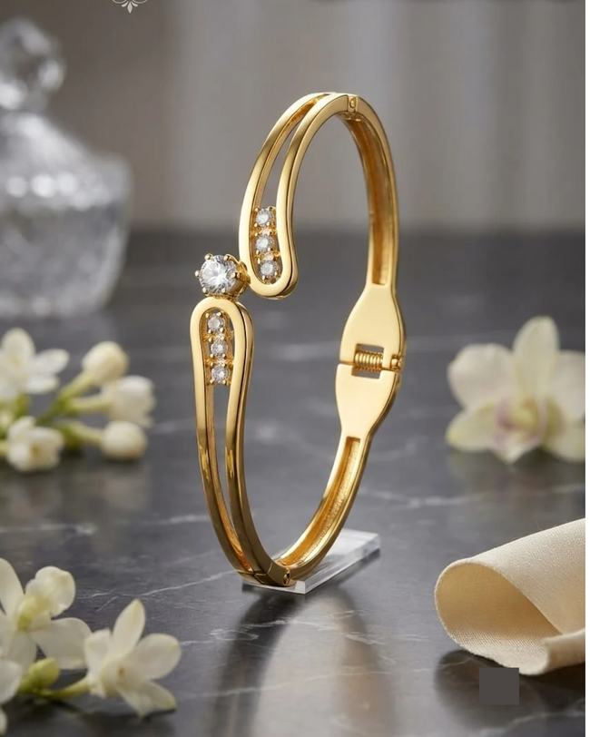 Aferando anti-tarnish baby size gold bangle bracelet, spring hinged, round centre stone and stone-set curved loops
