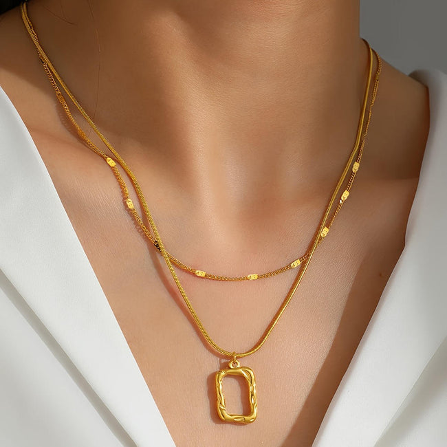 Anti-tarnish 18K gold plated double layered necklace worn 
on neck — snake chain and satellite chain with hollow 
geometric square pendant for women