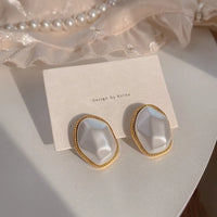 Aferando Elegant Big Irregular Pearl in Gold Plated Geometric Metal Frame Stud Earrings for Women