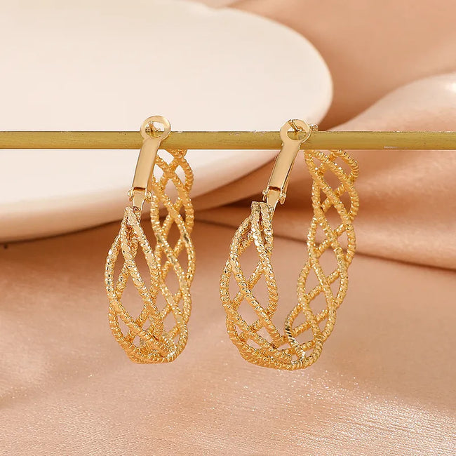 Unusual gold hoop top earrings