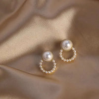 Aferando Gold Plated Korean Style Big Pearl Huggie Small Pearl Circle Hoop Stud Earrings, a unique and elegant piece of jewelry for women.