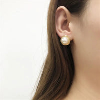 Aferando Gold Plated Round Big Pearl Stud Earring for Women in elegant design on a white background