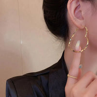 Aferando Gold Plated Simple Heart Shaped Big Hoop Earrings for Women - Close-Up View
