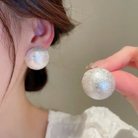 Aferando's White Oversized Uneven Texture Pearl Statement Stud Earrings for Women, beautifully crafted in gold plated material with a big size white pearl for a luxurious look.